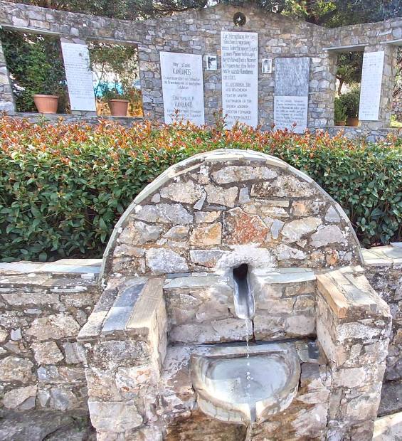 A source and a memorial wall in Kandanos Village.