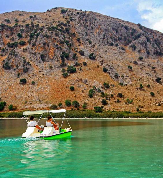 Two people on a pedal boat in Lake Kournas.