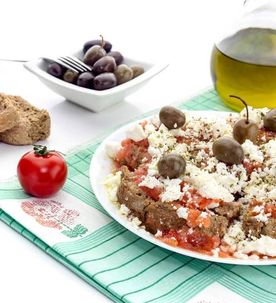 A Cretan Dakos, olives, and olive oil.
