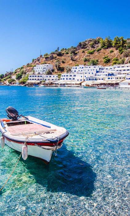 A small fishing boat in the waters of Loutro Beach.