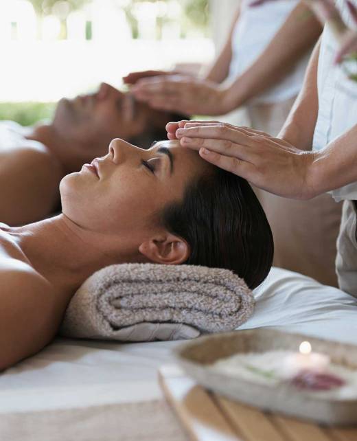 A couple enjoys their massage session.