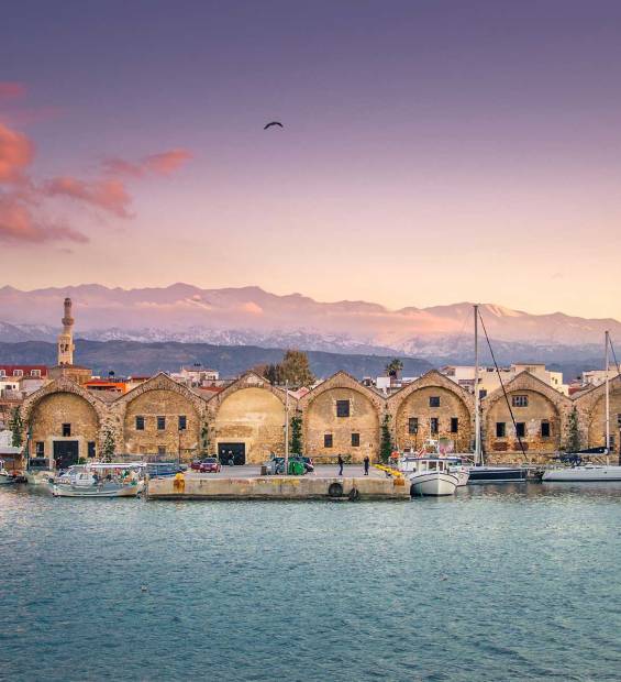 The Venetian Shipyards (Neoria) and small boats in Chania Old Harbor.