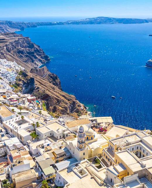 A big cruise ship overlooking the Caldera and Imerovigli in Santorini.