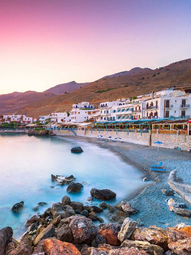 Sunset view of the small houses in Chora Sfakion Village.