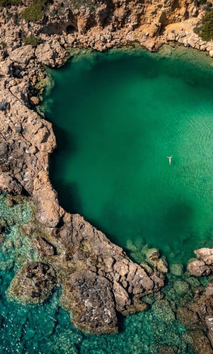 A woman swims in Voulolimni.